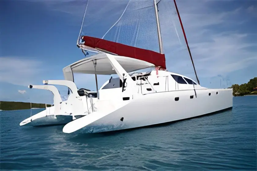 White catamaran sailboat on turquoise water